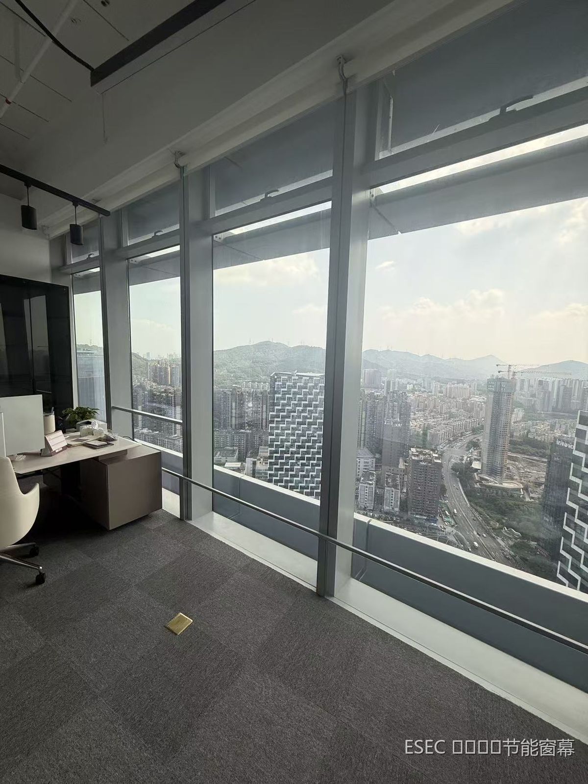 Installing the curtain on the interior side of a high-rise office curtain wall